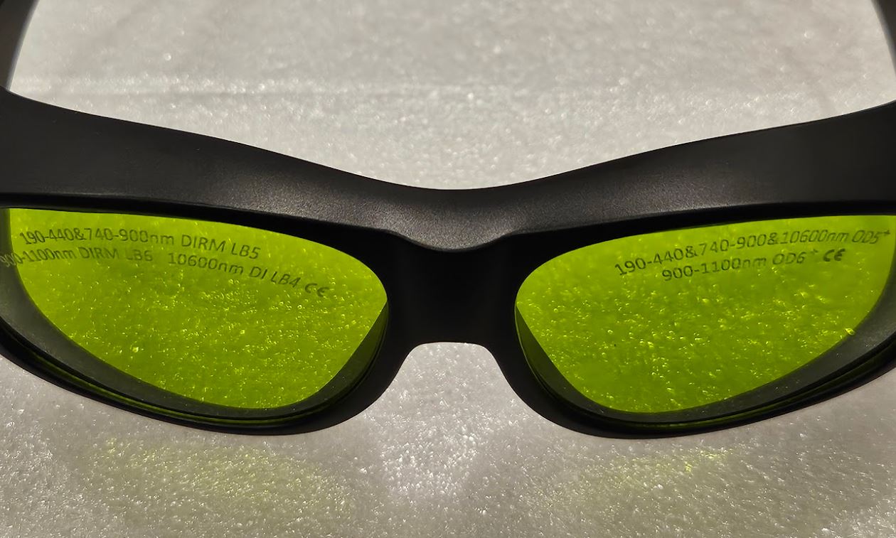 Close up view of protection ratings on green fibre laser glasses